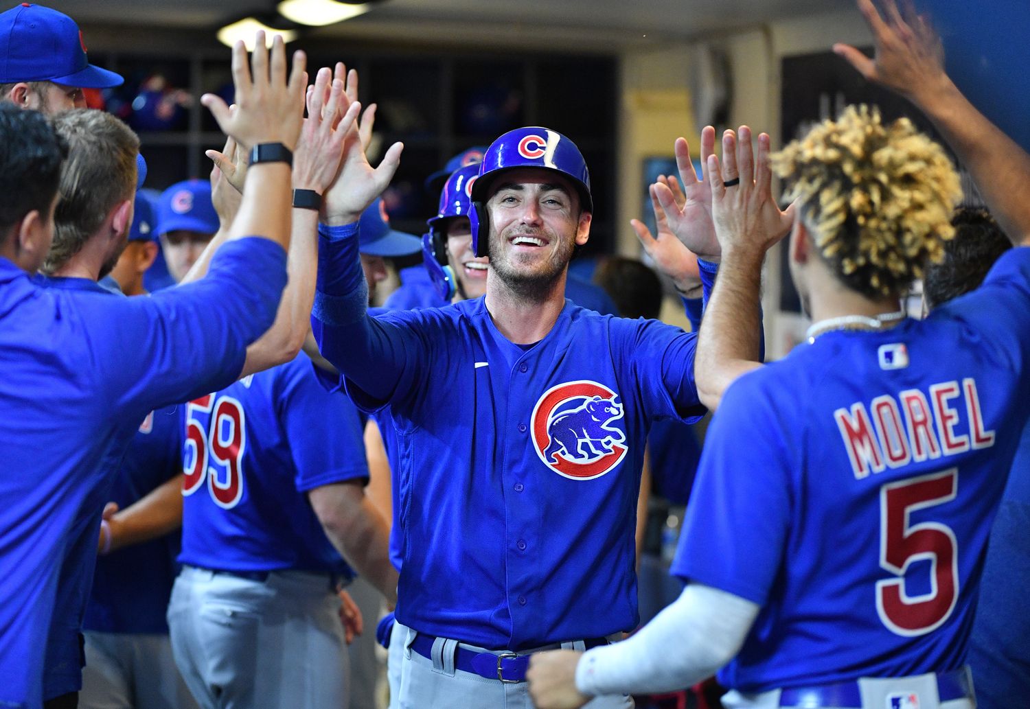 Jul 5, 2023; Milwaukee, Wisconsin, USA; Chicago Cubs center fielder Cody Bellinger (24) celebrates after tying the score against the Milwaukee Brewers in the ninth inning at American Family Field. Mandatory Credit: Michael McLoone-USA TODAY Sports